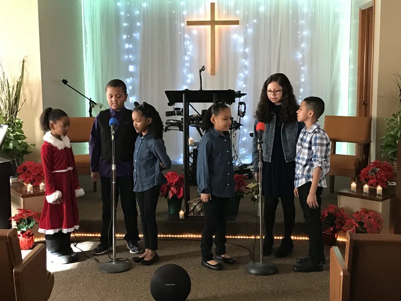Young people singing together in New Hope’s sanctuary